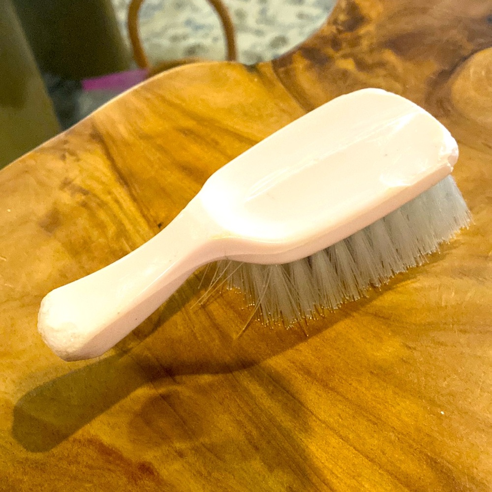 Vintage 1950s pink early lucite Handheld baby brush. So much character.